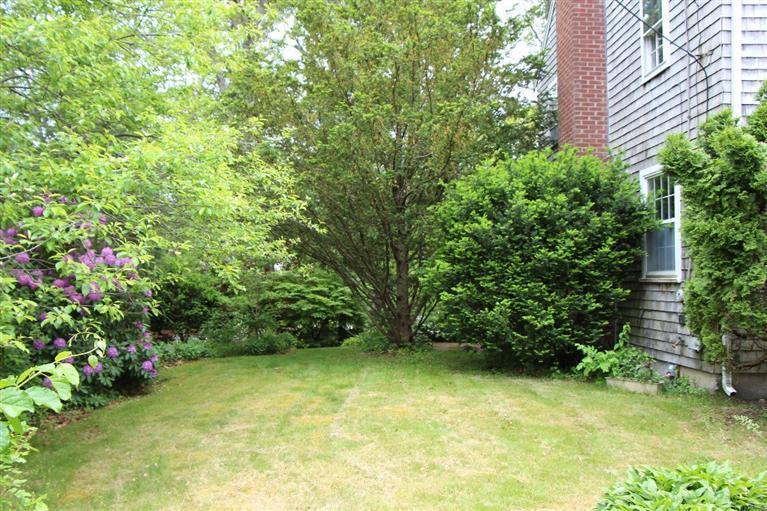 1 Cross Road Bourne, MA 02532 - Photo 5 of 22 a view of a yard with potted plants