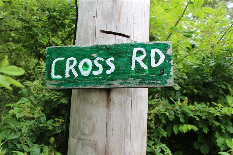 1 Cross Road Bourne, MA 02532 - Photo 6 of 22 a close up of a street sign