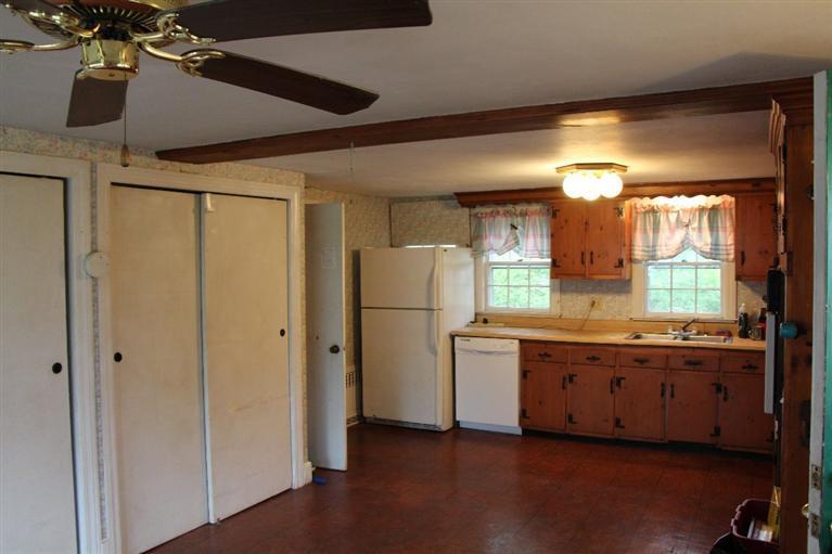 1 Cross Road Bourne, MA 02532 - Photo 10 of 22 a kitchen with stainless steel appliances granite countertop a refrigerator and a sink