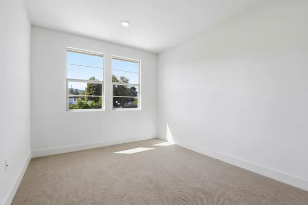 a bathroom with a sink mirror and toilet