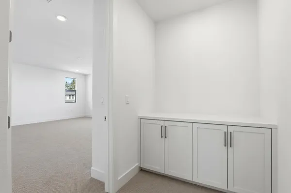 a view of an empty room with a window