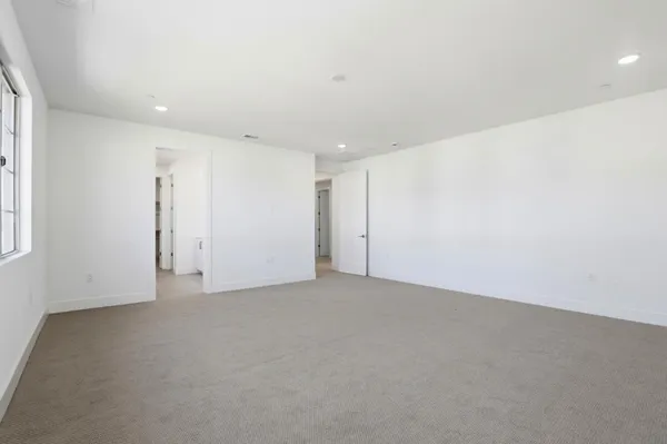 a spacious bathroom with a shower sink double and mirror