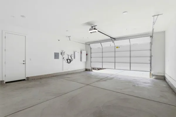 a view of a house with wooden fence