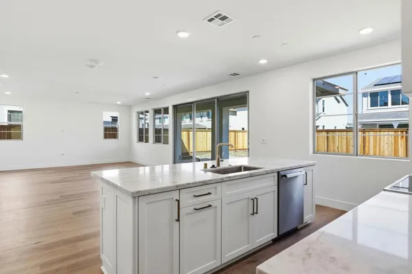 a kitchen with sink and window