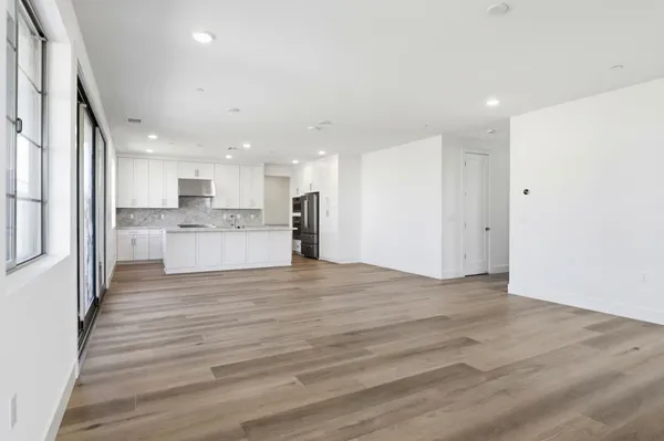 a view of kitchen with wooden floor