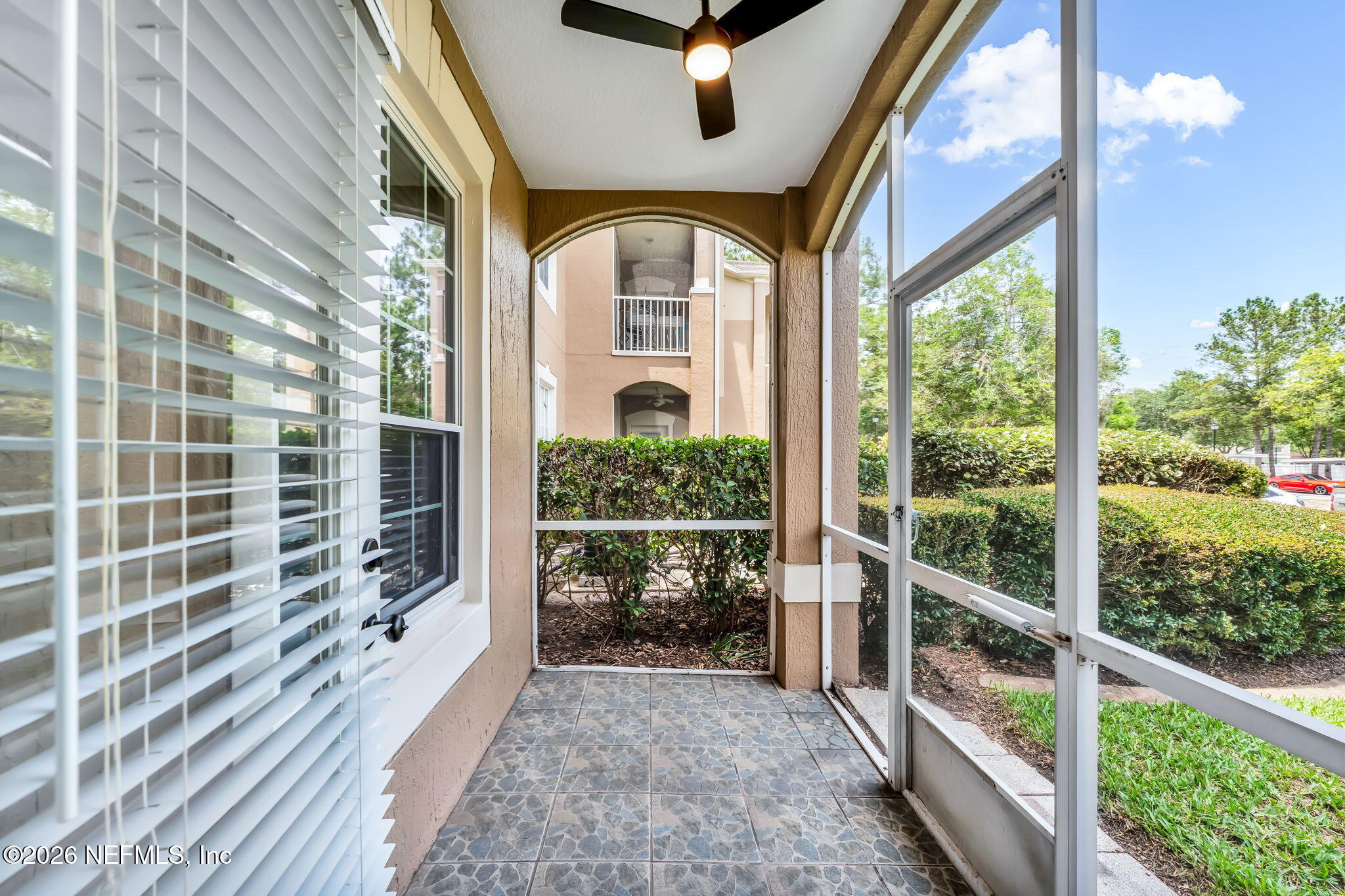 7990 Baymeadows Road East, Unit 520 Jacksonville, FL 32256 - Photo 27 of 41 a view of a glass door with a balcony
