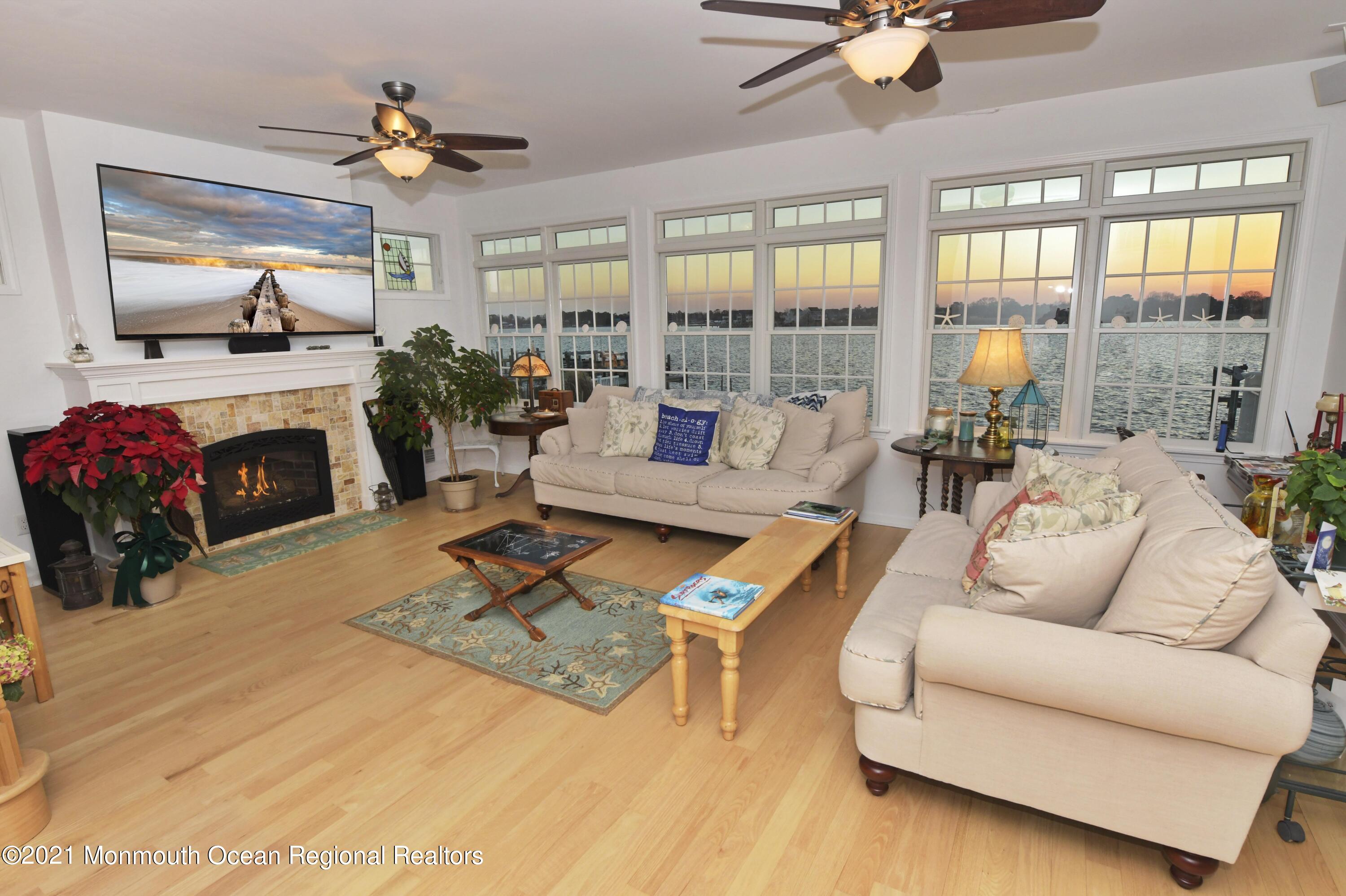 64 Seagoin Road Brick, NJ 08723 - Photo 7 of 48 a living room with furniture fireplace and a flat screen tv