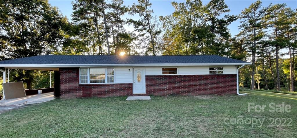 3180 Foster Road Cleveland, NC 27013 - Photo 1 of 16 front view of a house with a yard