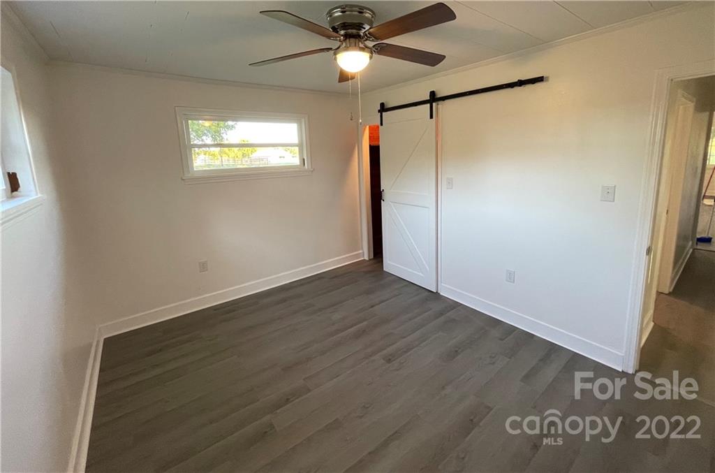 3180 Foster Road Cleveland, NC 27013 - Photo 6 of 16 a view of an empty room with a window