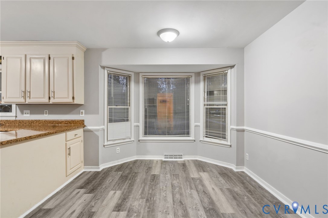 10204 Stonecrest Road Chesterfield, VA 23236 - Photo 11 of 36 an empty room with wooden floor and windows