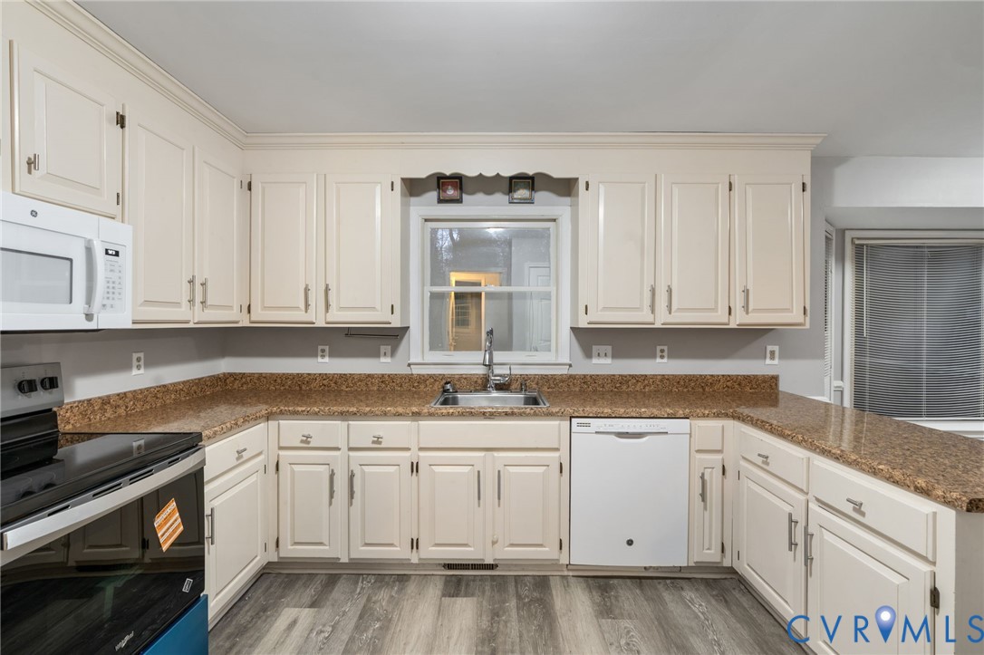 10204 Stonecrest Road Chesterfield, VA 23236 - Photo 13 of 36 a white kitchen with granite countertop white cabinets and white appliances