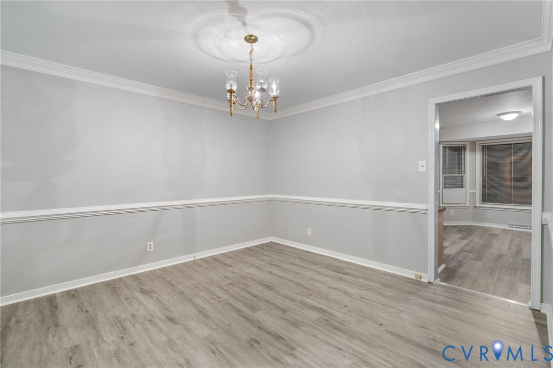 10204 Stonecrest Road Chesterfield, VA 23236 - Photo 19 of 36 a view of an empty room with wooden floor