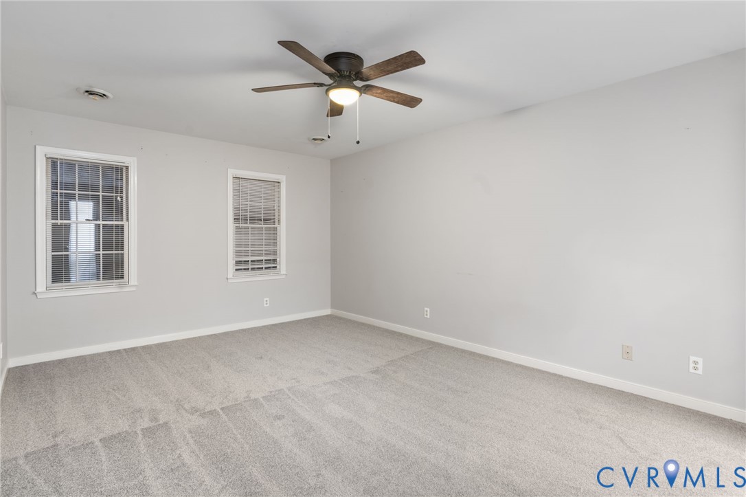10204 Stonecrest Road Chesterfield, VA 23236 - Photo 23 of 36 an empty room with windows and ceiling fan