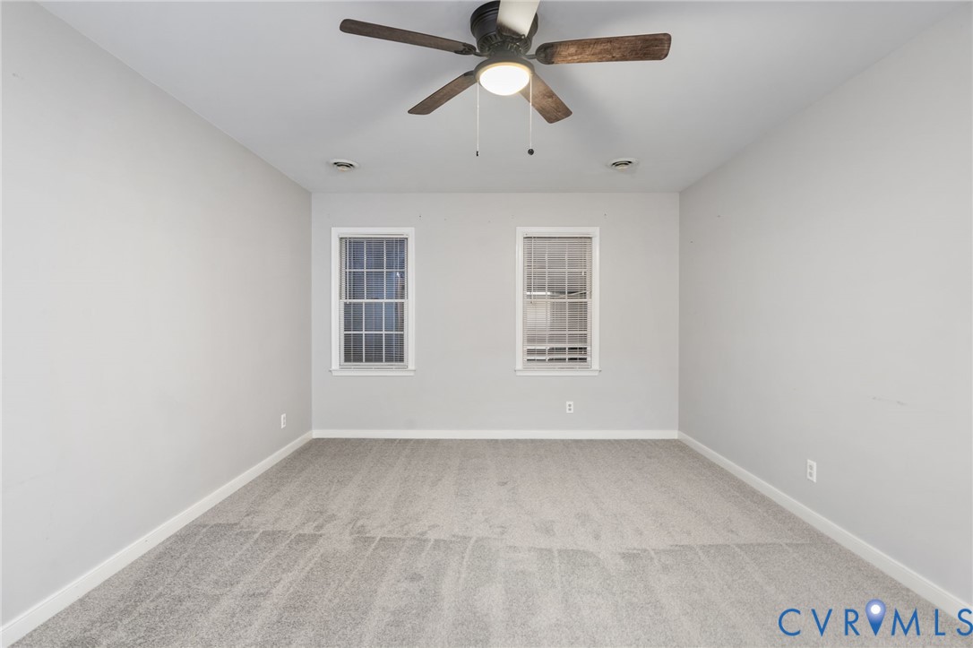 10204 Stonecrest Road Chesterfield, VA 23236 - Photo 24 of 36 an empty room with windows and fan