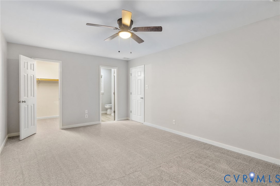 10204 Stonecrest Road Chesterfield, VA 23236 - Photo 25 of 36 an empty room with a ceiling fan and a window