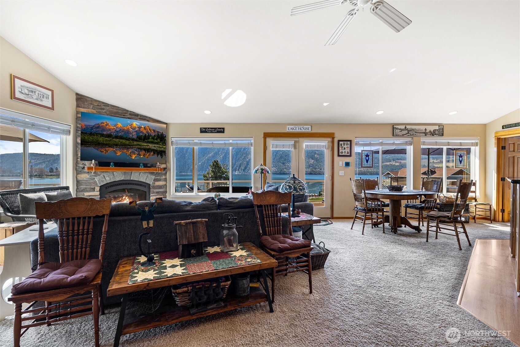 563 Topaz Place Manson, WA 98831 - Photo 11 of 38 a living room with furniture a fireplace and a flat screen tv
