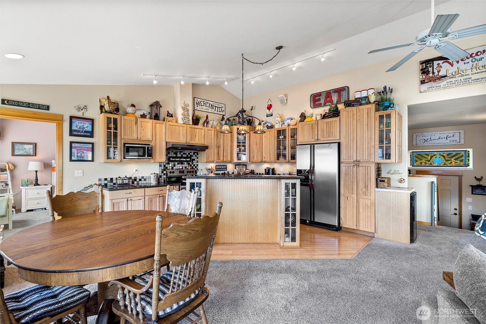 563 Topaz Place Manson, WA 98831 - Photo 15 of 38 a dining room with furniture a large window and kitchen view