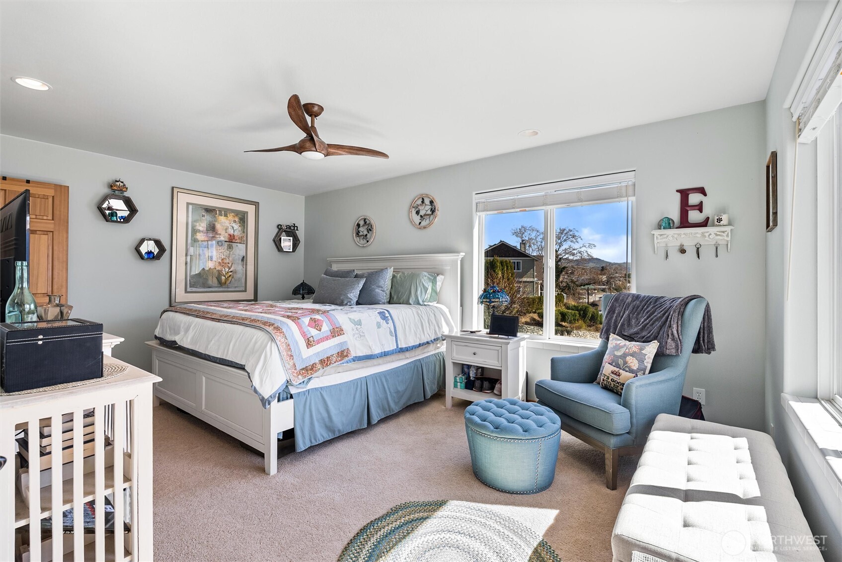 563 Topaz Place Manson, WA 98831 - Photo 20 of 38 a bedroom with a bed couch and window