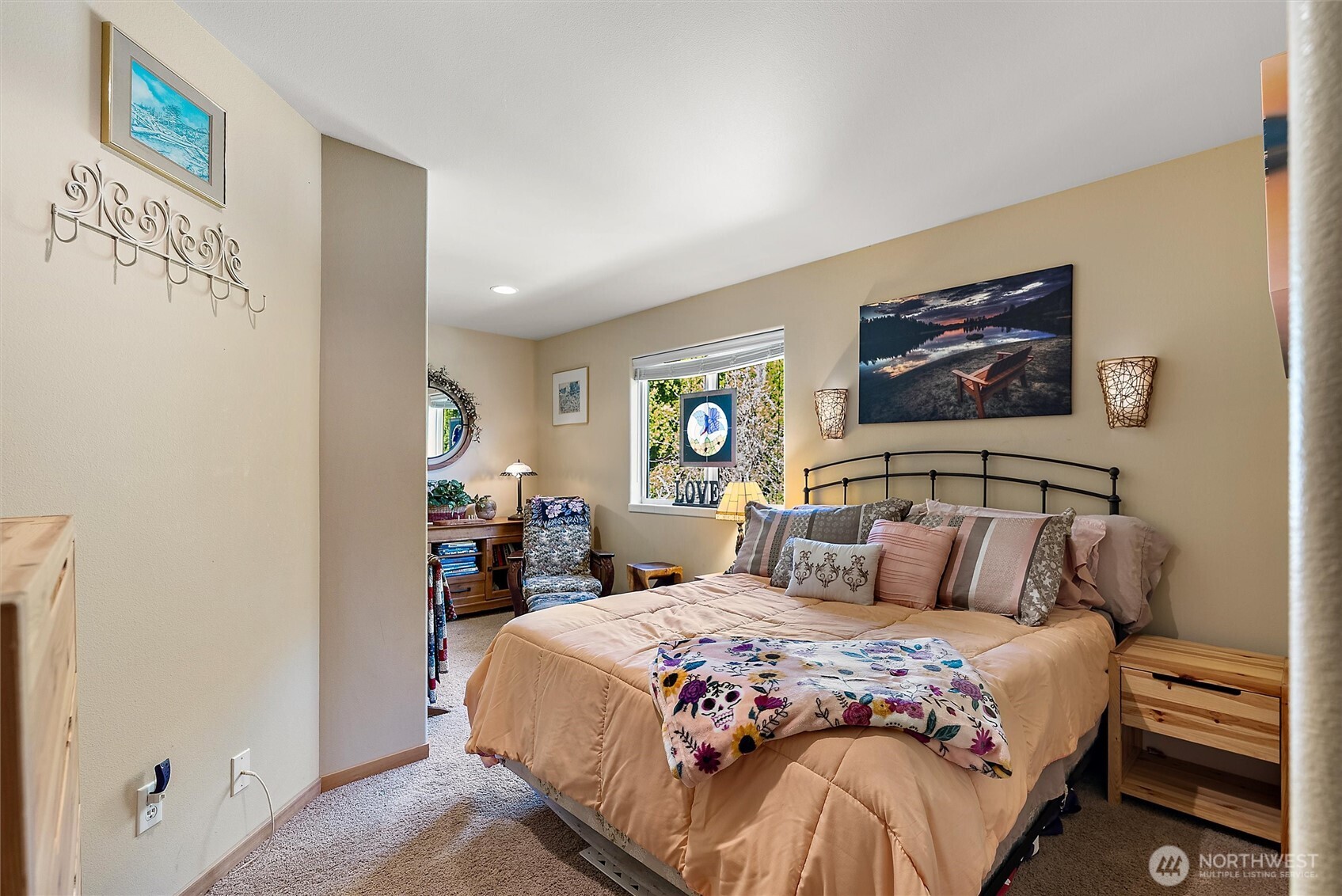 563 Topaz Place Manson, WA 98831 - Photo 22 of 38 a bedroom with a bed and a painting on the wall