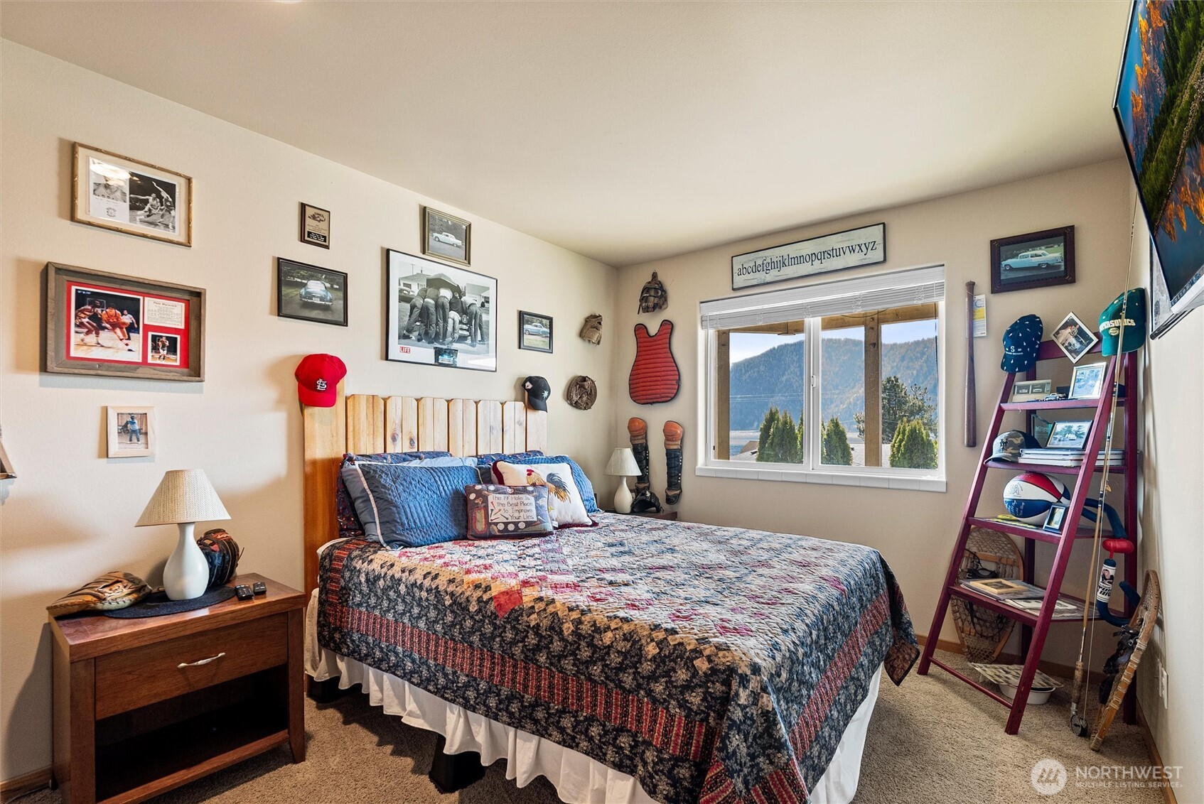 563 Topaz Place Manson, WA 98831 - Photo 30 of 38 a bedroom with a bed and wooden floor