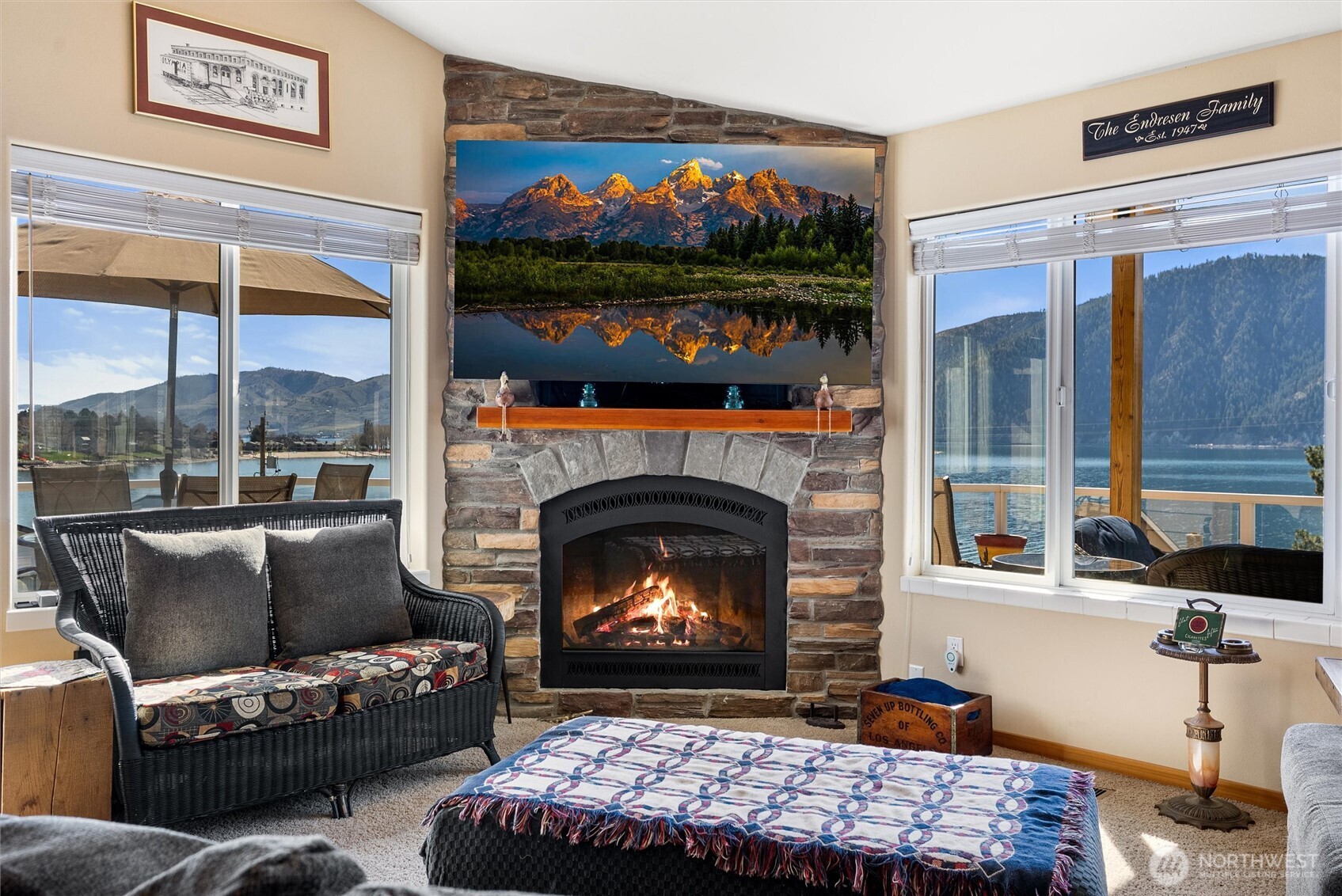 563 Topaz Place Manson, WA 98831 - Photo 10 of 38 a living room with furniture a flat screen tv and a fireplace