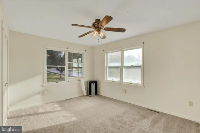 a view of empty room with windows