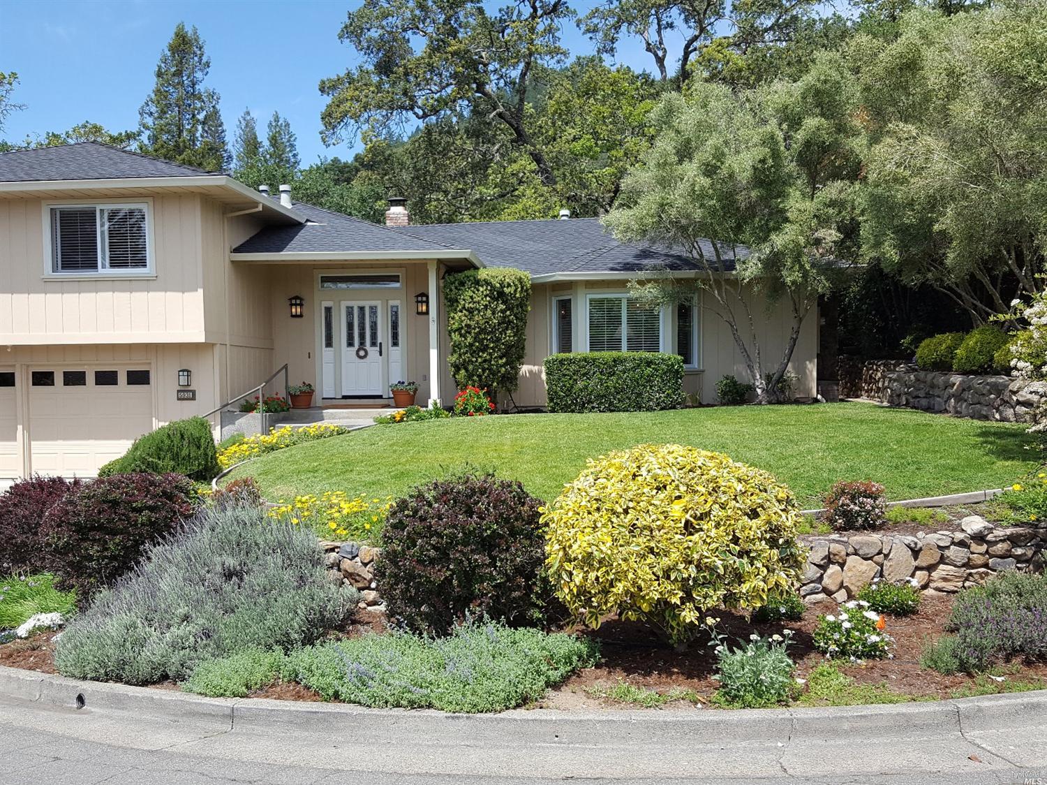5931 Del Rey Court Santa Rosa, CA 95409 - Photo 1 of 1 a front view of a house with a yard