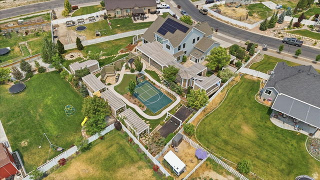 2038 East Ranch Road Eagle Mountain, UT 84005 - Photo 62 of 66 Expansive property featuring a multi-sport court, multiple pergolas, and a dedicated fire pit area