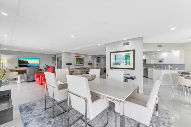 a kitchen with stainless steel appliances kitchen island granite countertop a sink and cabinets