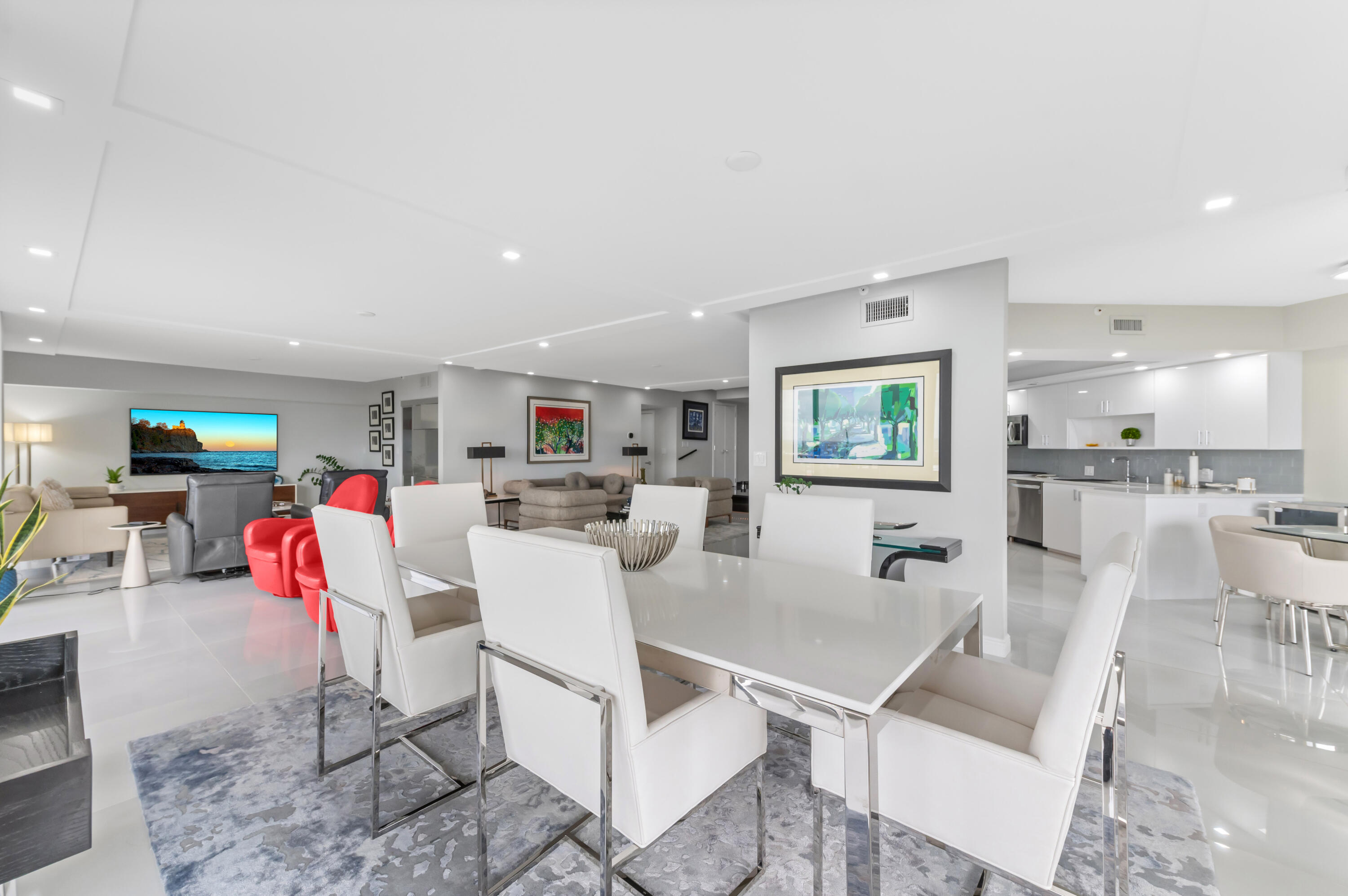 1900 Consulate Place, Unit 2104 West Palm Beach, FL 33401 - Photo 12 of 72 a living room with furniture and kitchen view