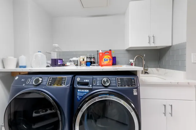 a bedroom with a large bed and a flat screen television
