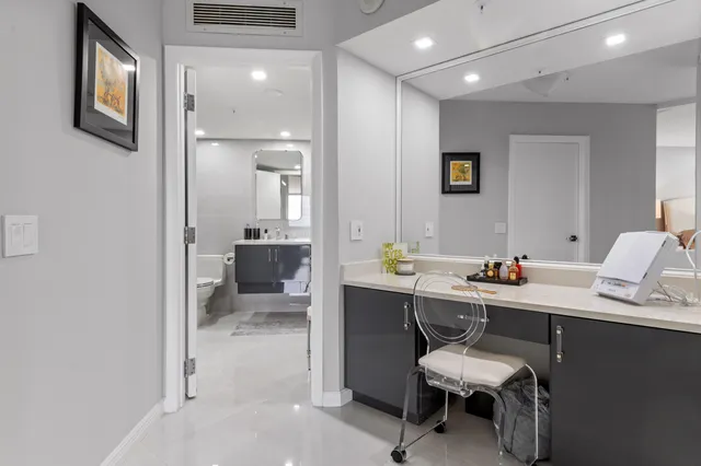 a bedroom with a bed and a table in it