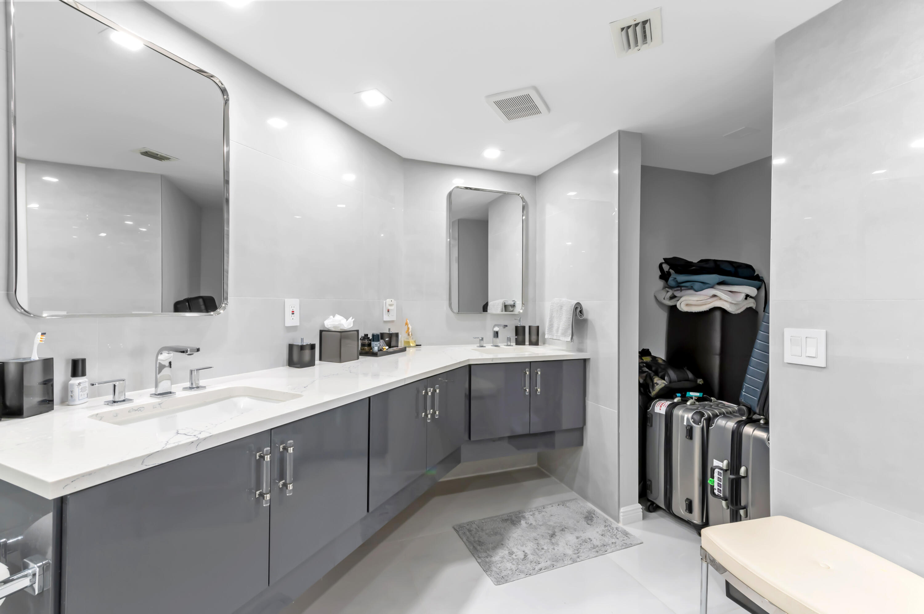 1900 Consulate Place, Unit 2104 West Palm Beach, FL 33401 - Photo 25 of 72 a bathroom with a sink vanity toilet and shower
