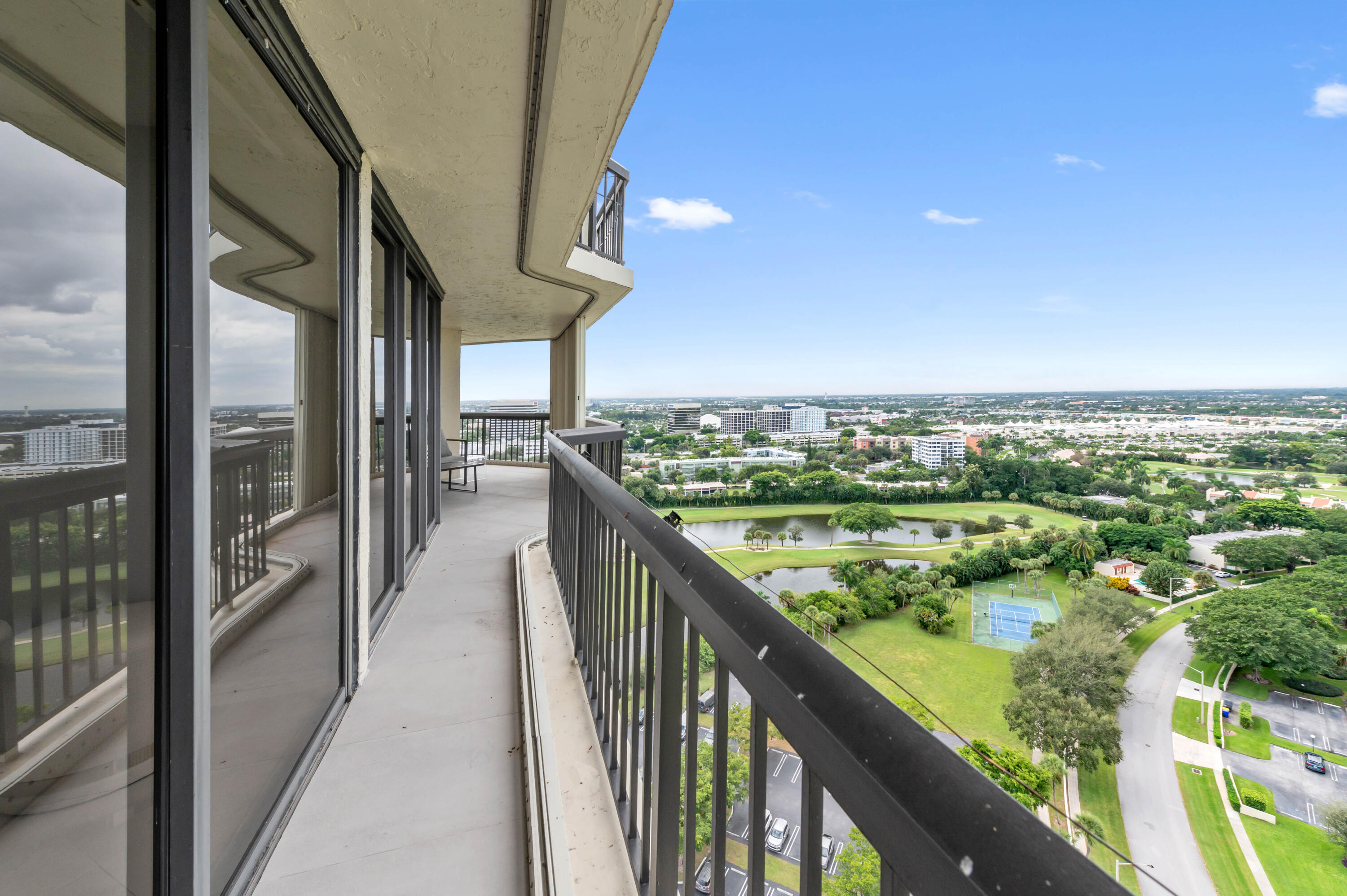 1900 Consulate Place, Unit 2104 West Palm Beach, FL 33401 - Photo 32 of 72 a view of swimming pool from a balcony