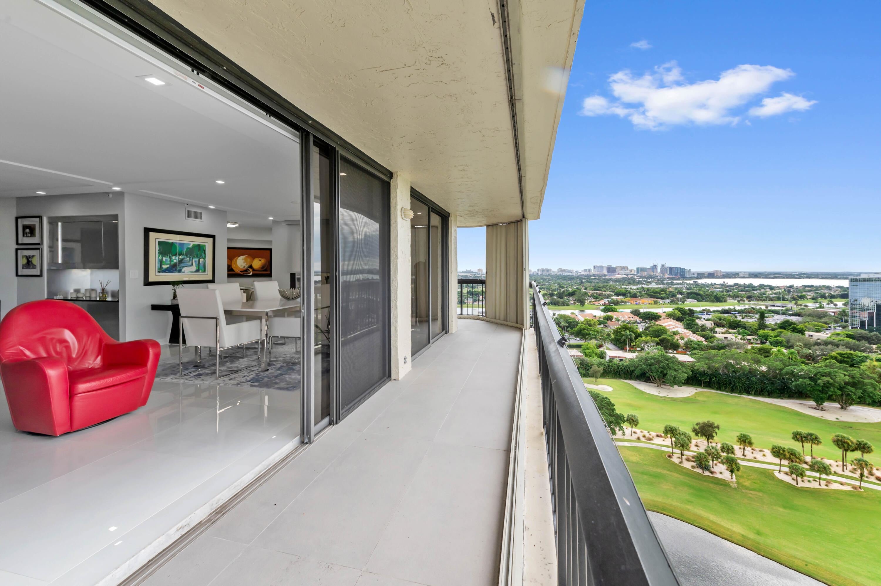 1900 Consulate Place, Unit 2104 West Palm Beach, FL 33401 - Photo 33 of 72 a view of a living room and kitchen