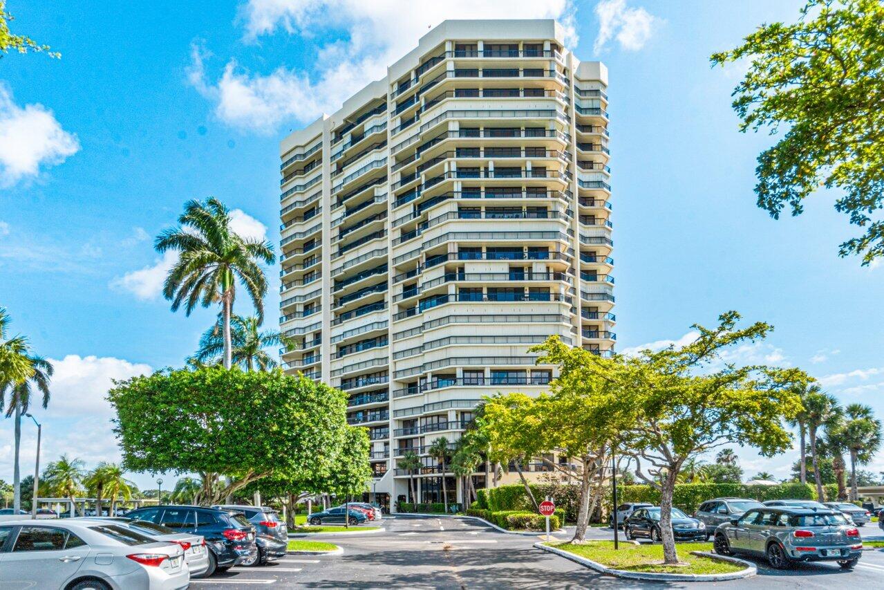 1900 Consulate Place, Unit 2104 West Palm Beach, FL 33401 - Photo 39 of 72 a front view of a building with tree s