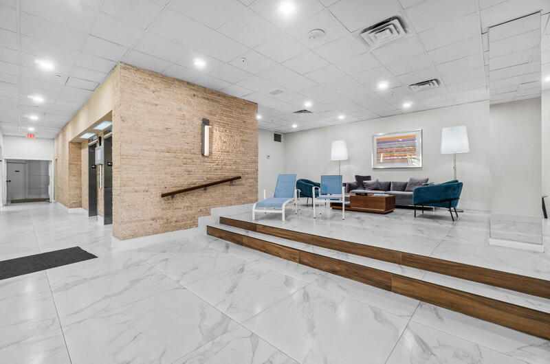 1900 Consulate Place, Unit 2104 West Palm Beach, FL 33401 - Photo 47 of 72 a view of kitchen with stainless steel appliances granite countertop lots of counter top space