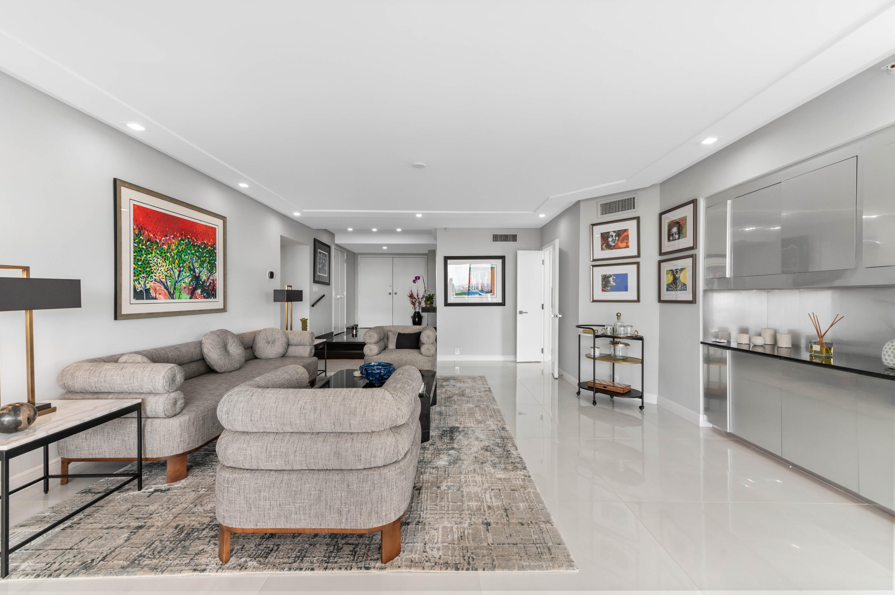 1900 Consulate Place, Unit 2104 West Palm Beach, FL 33401 - Photo 5 of 72 a living room with furniture and painting on the wall