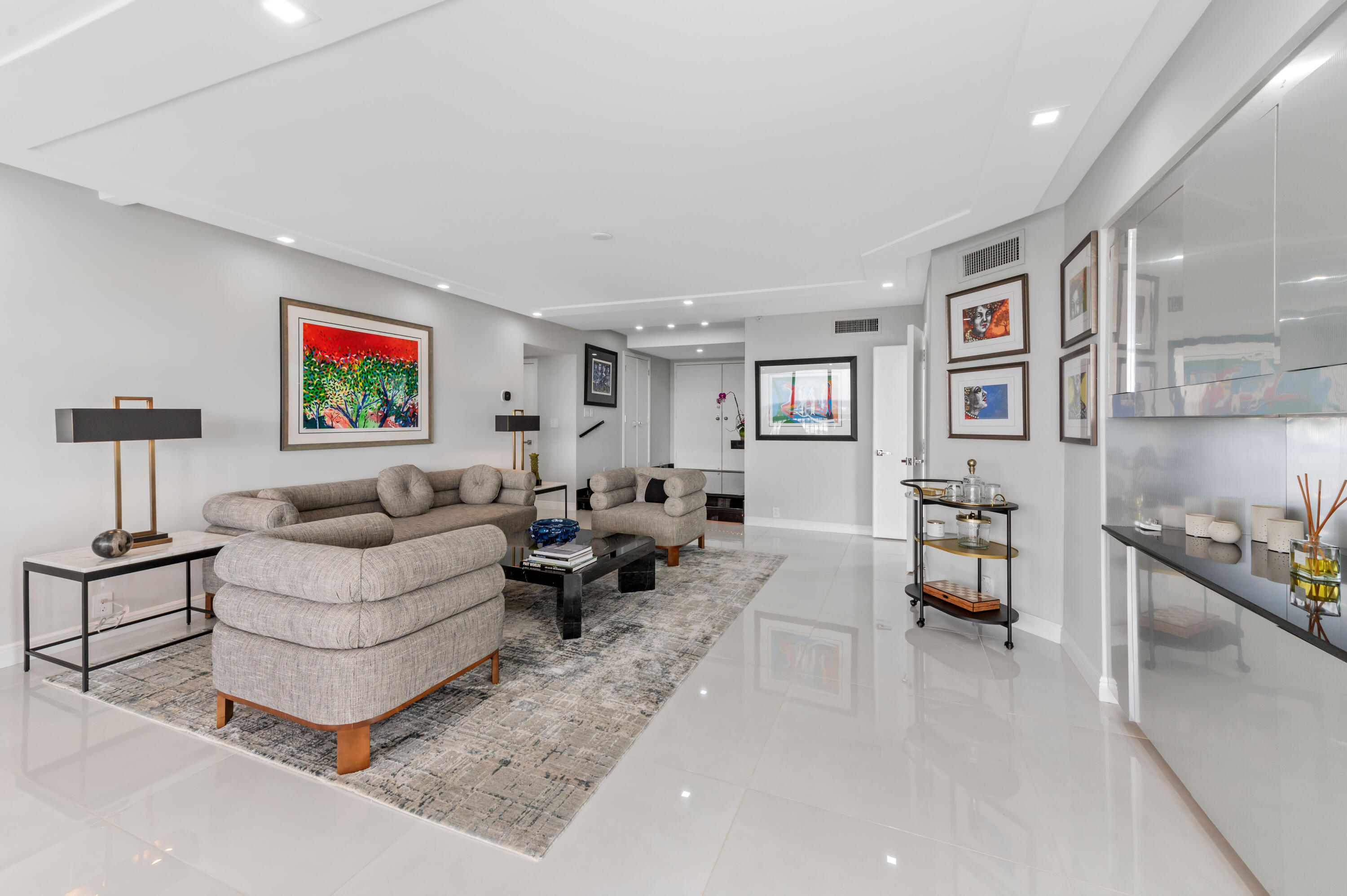 1900 Consulate Place, Unit 2104 West Palm Beach, FL 33401 - Photo 6 of 72 a living room with furniture and painting on the wall