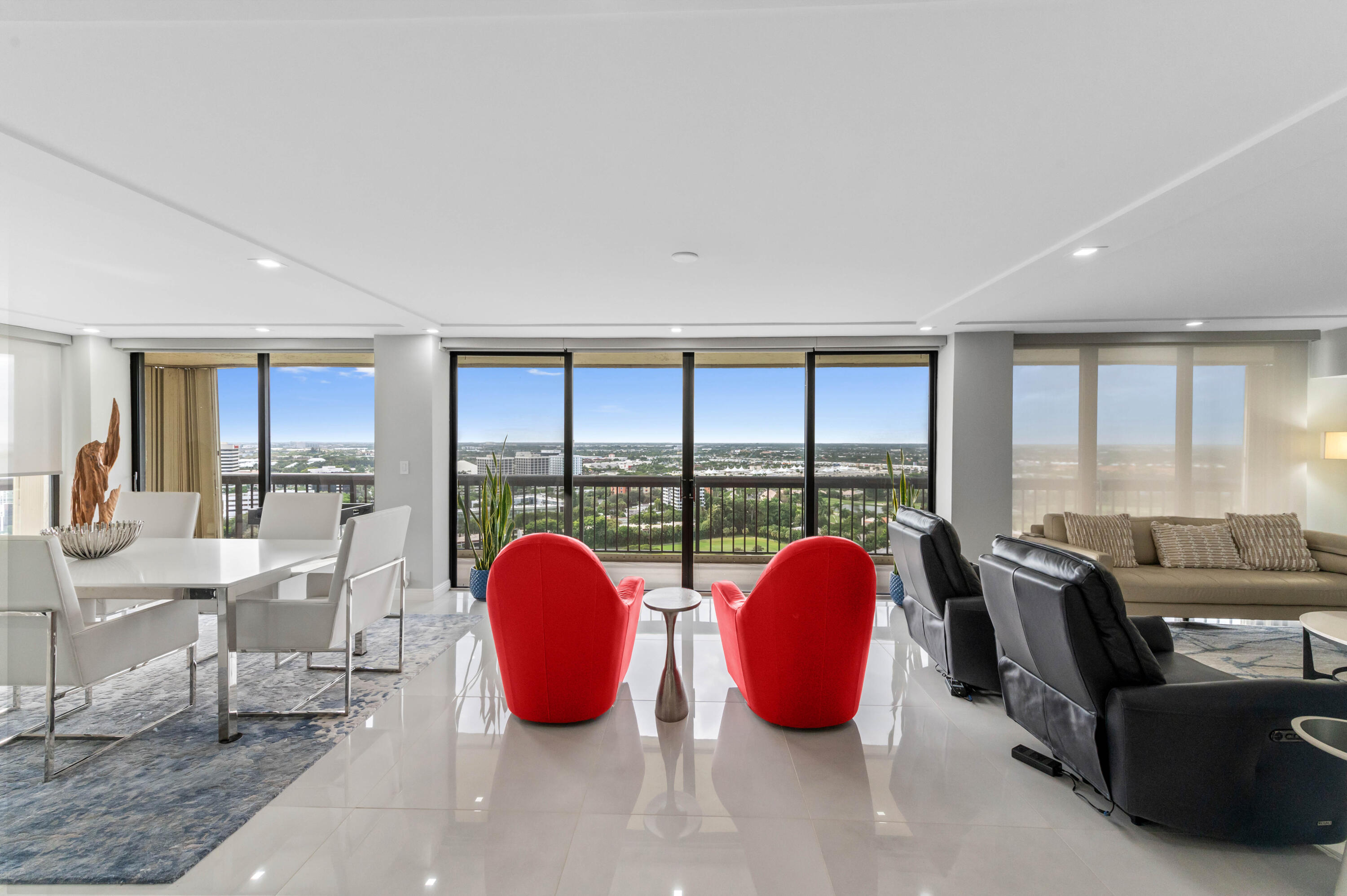 1900 Consulate Place, Unit 2104 West Palm Beach, FL 33401 - Photo 7 of 72 a view of a dining room with furniture and floor to ceiling window