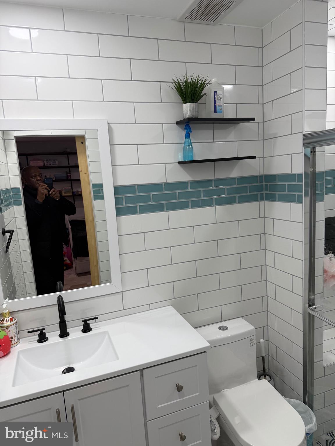 1801 Egg Harbor Road, Unit 712 Clementon, NJ 08021 - Photo 13 of 35 a bathroom with a sink toilet and mirror