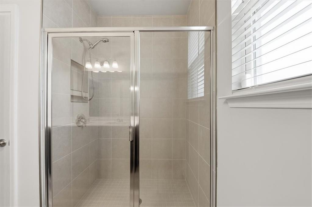 61 Rushing View Glen Dallas, GA 30157 - Photo 15 of 54 a bathroom with a glass shower door