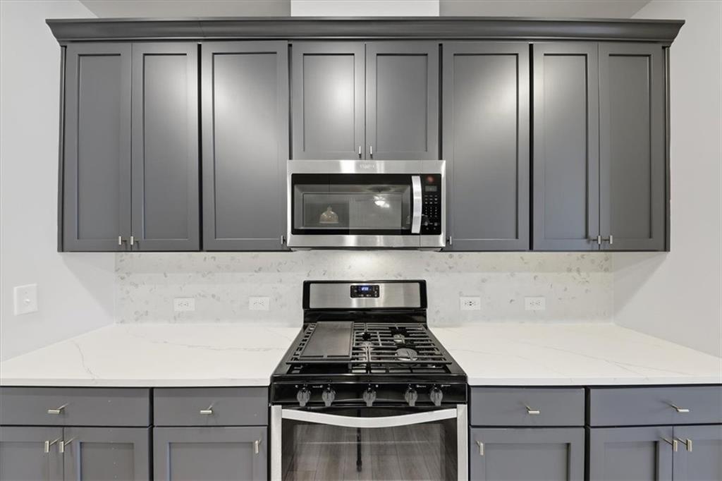 61 Rushing View Glen Dallas, GA 30157 - Photo 24 of 54 a kitchen with granite countertop a stove and a microwave