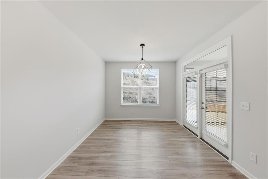 61 Rushing View Glen Dallas, GA 30157 - Photo 26 of 54 wooden floor in an empty room with a window
