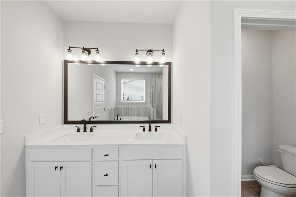 61 Rushing View Glen Dallas, GA 30157 - Photo 31 of 54 a bathroom with a sink and a mirror