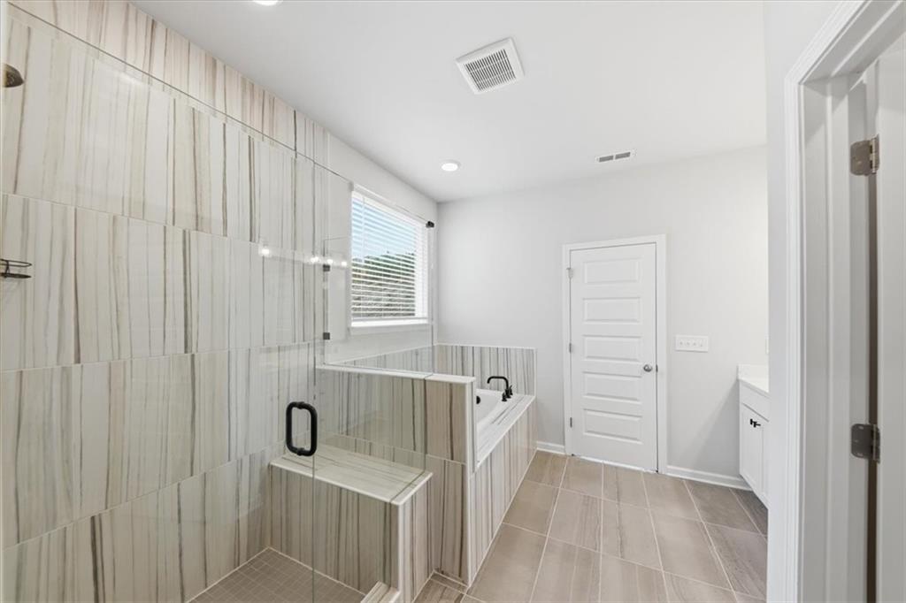 61 Rushing View Glen Dallas, GA 30157 - Photo 33 of 54 a bathroom with a sink and a tub