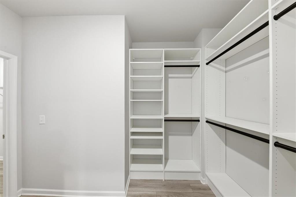 61 Rushing View Glen Dallas, GA 30157 - Photo 34 of 54 a view of walk in closet with empty racks
