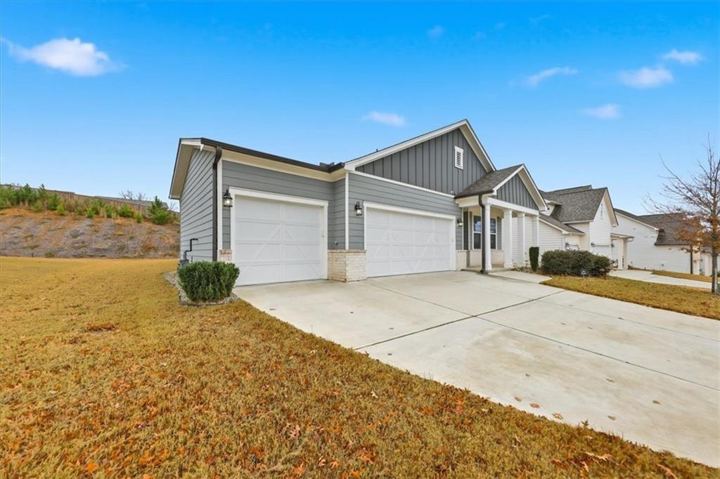 61 Rushing View Glen Dallas, GA 30157 - Photo 4 of 54 a front view of a house with a yard and garage