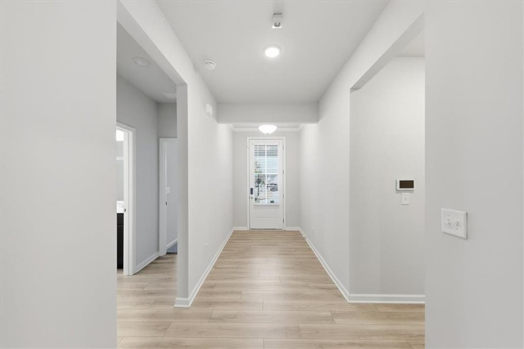 61 Rushing View Glen Dallas, GA 30157 - Photo 7 of 54 a view of a hallway with wooden floor