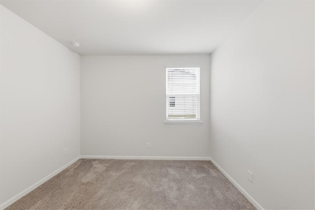 61 Rushing View Glen Dallas, GA 30157 - Photo 9 of 54 an empty room with windows